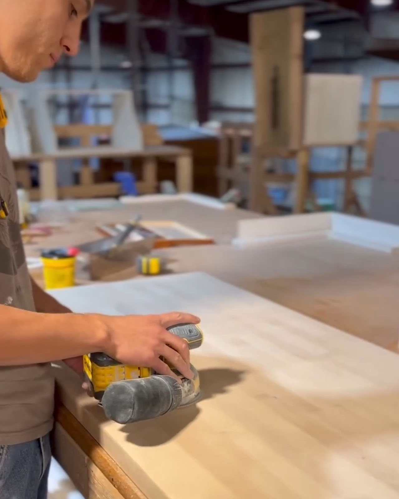 Kingdom Tiny Homes crafts tiny homes with care. Worker hand-sanding for a smooth and beautiful finish. 